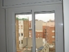Ventana corredera en Aluminio y registro persiana de superficie